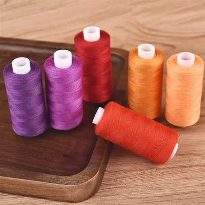 Set of 6 colorful thread spools from The LaceMaker Diary, showcasing vibrant, neatly wound sewing or embroidery threads.