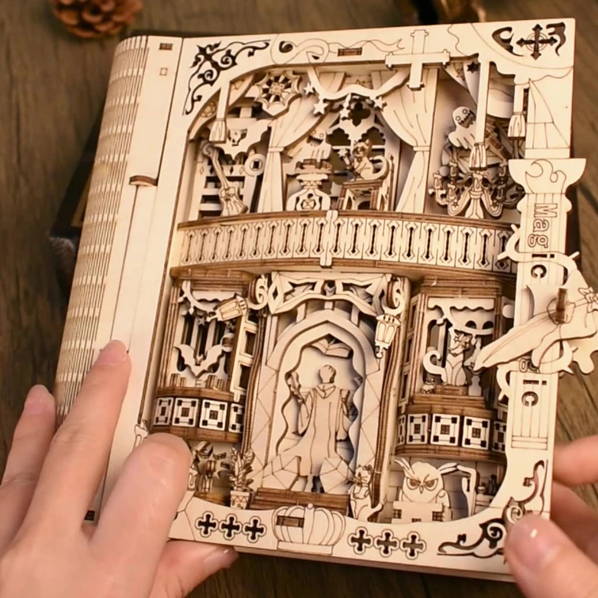 Wooden puzzle shaped like a magic book by The LaceMaker Diary, showcasing detailed craftsmanship and intricate design.