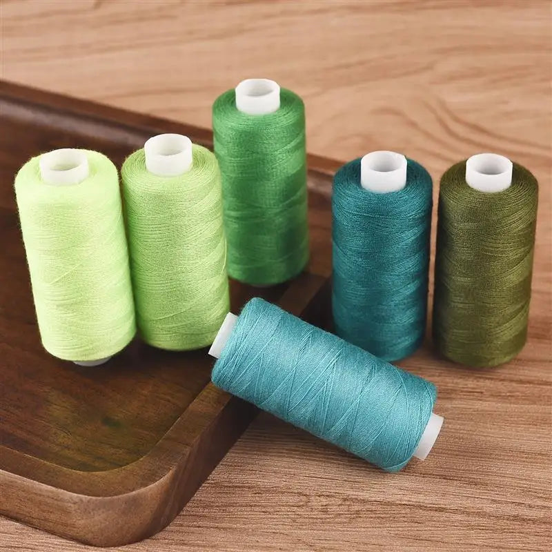 Set of 6 colorful thread spools from The LaceMaker Diary, showing vibrant threads for lace and embroidery projects.