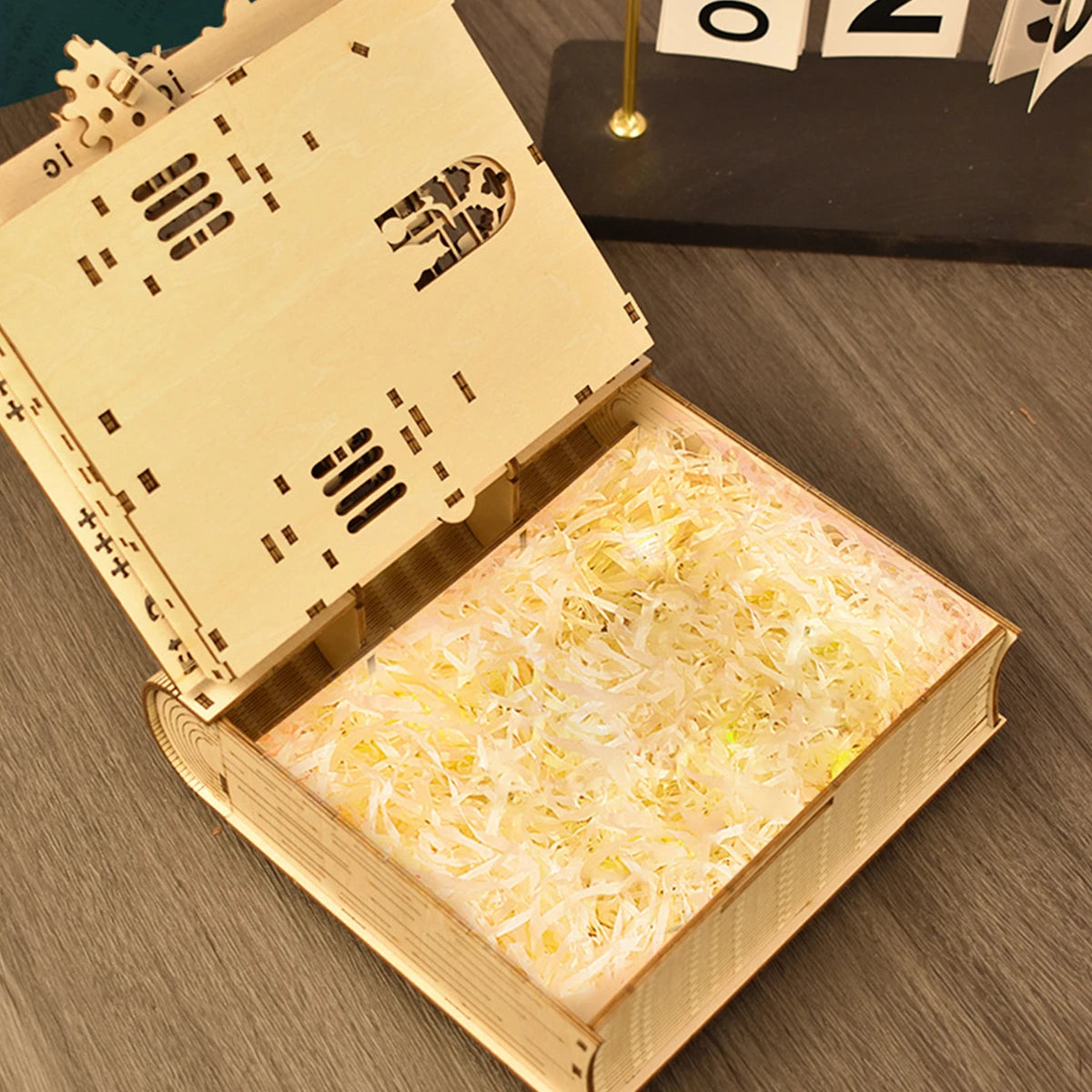 Wooden puzzle shaped like a magic book by The LaceMaker Diary, featuring intricate carved details and a whimsical design.
